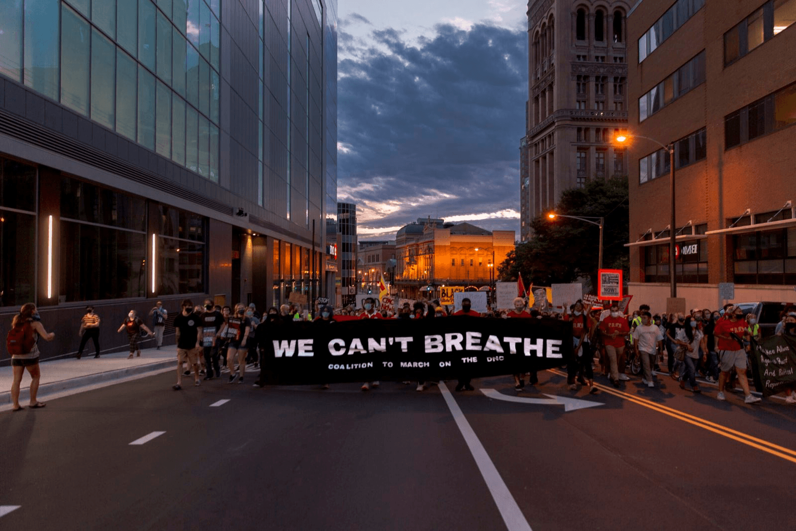 Protesters holding a banner reading 'Coalition to March on the Republican National Convention